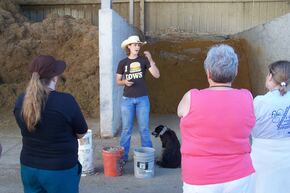 Ange Kapperman talks about cattle nutrition at Doug Van Duyn's feed lot near Colton, SD.